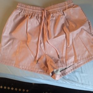 Pink faux leather shorts, size L